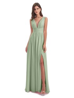 a woman wearing a long green dress with a slit down the side and one leg