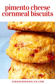 three cheesy cornmeal biscuits stacked on top of each other with text overlay