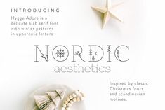 an advertisement for nordic aesthetics with ornaments on the plate and paper stars in the background