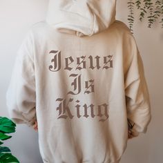 Our unisex Jesus is King Hoodie is one of our bestsellers and will be your new fave hoodie! This is an original Blessed Apparel design© DO NOT COPY! All copies will be reported and may result in loss of your store. ABOUT BLESSED APPAREL Spread the Word of God to the world with our unisex Christian Clothing All orders are made to order and prayed over, just for you! 10% of all profits go to children and families fighting poverty through Compassion. Be bold with your faith, you never know who it m Fan Apparel Long Sleeve Sweatshirt With Adjustable Hood, Cotton Fan Apparel Hoodie, Hip Hop Cotton Hoodie Pre-shrunk, Pre-shrunk Hooded Sweatshirt For Streetwear, Fan Apparel Hoodie Sweatshirt With Adjustable Hood, Fan Apparel Hoodie With Drawstring, Fan Apparel Sweatshirt With Adjustable Hood, Adjustable Hood Fan Apparel Sweatshirt, Pre-shrunk Relaxed Fit Hoodie For Fans