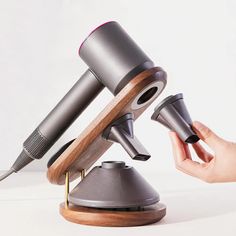 PRICES MAY VARY. 【Unique Design for Dyson】It can be used as the holder of hair dryer, diffuser and nozzle, which can firmly support your Dyson hair dryer in 45 degree support mode. This magnetic hair dryer bracket can be compatible with all dyson supersonic models, it can accommodate all hair dryer nozzle accessories. (Dyson hair dryer and all accessories are not included.) 【High Quality】This hair dryer stand holder uses solid wood as raw material, and its surface is treated with open spray pain Supersonic Hair Dryer, Lazy Hair, Hair Dryer Stand, Hair Dryer Accessories, Dyson Hair, Bathroom Stand, Dryer Stand, Hair Dryer Diffuser, Dyson Hair Dryer