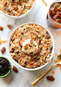 two bowls filled with oatmeal and fruit