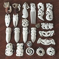 many different types of carved objects on a table