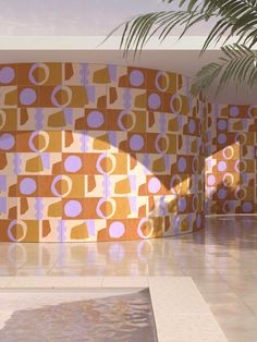 an artisticly designed room with orange and blue tiles on the wall, palm tree in the foreground