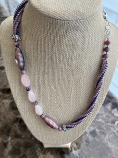 Twisted Herringbone necklace with rose quartz, pink/blue agate beads and rhodochrosite beads in the center. The necklace can be extended from 19 to 23 inches with a silver plated paperclip chain and a lobster claw clasp. Pink Single Strand Bohemian Beaded Necklaces, Pink Bohemian Single Strand Beaded Necklaces, Bohemian Pink Single Strand Beaded Necklaces, Pink Adjustable Multi-strand Necklace, Bohemian Pink Rose Quartz Necklace, Adjustable Pink Necklace With Gemstone Beads, Adjustable Pink Gemstone Beads Necklace, Bohemian Pink Necklace With Polished Beads, Adjustable Pink Crystal Necklaces With Natural Stones