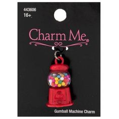 charm me gumball machine charm on a black card with the tag for charm me