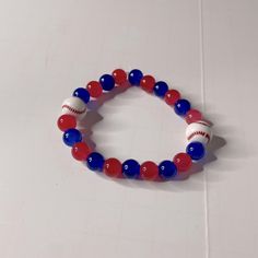 Handmade Elastic Red And Blue Bracelet With Baseballs On It Perfect For Any Cubs, Rangers, Braves, Guardians, Dodgers, Twins, Phillies, Or Blue Jays Fan Or Any Baseball Mom Or Fan One Size Fits Most Brand New, Never Worn Ships Within 1-2 Days B204 Red Adjustable Casual Beaded Bracelets, Casual Red Adjustable Beaded Bracelets, Adjustable Red Stretch Bracelet Casual Style, Casual Adjustable Red Beaded Bracelets, Handmade Red Stretch Bracelet For Beach, Handmade Adjustable Red Stretch Bracelet, Adjustable Red Handmade Stretch Bracelet, Casual Red Bracelets For Beach, Adjustable Red Stretch Bracelet For The Beach