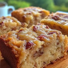 two pieces of cake sitting on top of a wooden cutting board