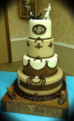 a three tiered wedding cake sitting on top of a table