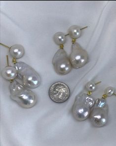 This handmade Baroque Pearl earrings is super gorgeous One of my Signature Series Collections, a bestseller, as modeled by Ms KT Reed. It is her go to earrings! Pls note, size of button pearl stud is from 10mm to 11mm, (this is what the model is wearing); pls let me know if you prefer a bigger, 12mm to 13mm or smaller pearl stud, 7mm to 8mm. Price remains the same. Available in gold plated or stainless steel, pls select. The Baroque or flameball cultured dangling pearls measure, 15mm to 17mm x 2 Pearl White Baroque Pearl Earrings For Wedding, Baroque Pearl Drop Earrings For Wedding, Baroque Pearl Wedding Earrings In Pearl White, Wedding Earrings With Baroque Pearl Charm, Wedding Baroque Pearl Earrings With Pearl Charm, Wedding Earrings With High Luster Baroque Pearls, Wedding Baroque Pearl Earrings With High Luster, Wedding Baroque Pearl Drop Jewelry, Baroque Pearl Bridal Earrings With Pearl Charm