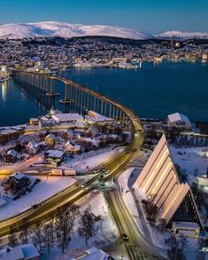 an aerial view of a city with snow on the ground