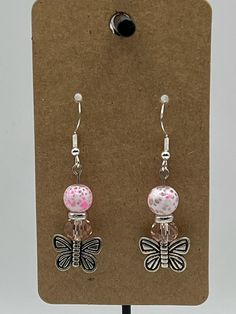 Handmade Earrings - Butterfly Series Each piece is meticulously handcrafted using craft wire, hypoallergenic earring hooks, and premium beads including crystal, glass, wood, ceramic, acrylic, resin, stone, and silicone beads. Care Instructions: Avoid moisture. Remove prior to bathing, showering, swimming, or exercising. Avoid allowing the item to fold when storing.  Shipping Information: Your items will be shipped within 1-2 business days once payment is received. Shipping within the US is via first class mail or you may choose to upgrade to Priority Mail for a small fee. First class shipping is free for orders over $35. Each item is carefully wrapped and packaged for safety during transit. Returns & Exchanges: As this is a wearable item, I do not accept returns or exchanges on this item. Pink Metal Beaded Earrings As Gift, Pink Metal Beaded Earrings For Gifts, Hypoallergenic Czech Glass Earrings For Gift, Adjustable Beaded Earrings For Gifts, Pink Czech Glass Earrings With Ear Wire, Pink Czech Glass Pierced Earrings, Adjustable Czech Glass Earrings With Ear Wire, Hypoallergenic Czech Glass Dangle Earrings, Adjustable Nickel Free Czech Glass Beaded Earrings