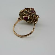 Antique 14K Yellow Gold Ruby Dome Ring, almost rose color gold, .5 inch high, .75 inch across, 4 pear shaped rubies, 12 round rubies, not calibre cut, 3.82 grams, Circa 1940, Size 7. SKU # BB264R25 Most rings are sizable for a small fee. If the ring you are considering is the incorrect size contact us for a quote. This listing contains photographs of the actual item you will receive. Our items are in excellent condition with little or no signs of wear and many are one of a kind pre-owned estate Vintage Multi-stone Ruby Ring In 14k Gold, Vintage Ruby Cluster Ring For Formal Occasions, Vintage Ruby Cluster Ring For Formal Events, Antique Multi-stone Ruby Ring, Antique 14k Gold Ruby Ring With Multi-stone, Vintage Multi-stone Ruby Cluster Ring, Vintage Ruby Multi-stone Cluster Ring, Vintage 14k Gold Multi-stone Ruby Ring, Vintage Ruby Cluster Ring With Multi-stones