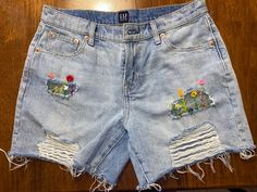 Cotton Jean Shorts With Floral Embroidery, Floral Embroidered Cotton Jean Shorts, Floral Embroidery Jean Shorts For Summer, Casual Floral Embroidery Jean Shorts For Spring, Cotton Floral Embroidery Shorts For Spring, Embroidered Cutoff Shorts For Summer, Floral Embroidered Jean Shorts For Summer, Casual Floral Embroidered Shorts For Spring, Summer Floral Embroidered Jean Shorts