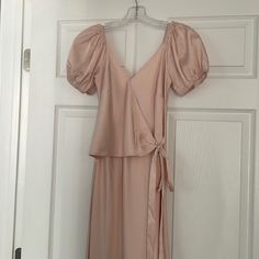 Long Pink Blush Dress. Size S. Never Worn. Cute Detail In Front . Pink Puff Sleeve Maxi Dress For Party, Pink Puff Sleeve Maxi Dress For Day Out, Chic Short Sleeve Midi Bridesmaid Dress, Elegant Peach Midi Dress For Evening, Pink Puff Sleeve Midi Dress For Date Night, Feminine Maxi Dress For Date Night, Chic Blush V-neck Maxi Dress, Blush Midi Dress For Summer Evening, Chic Blush Maxi Dress For Evening