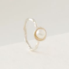 Silver & Pearl Ring - Each band on this elegant ring stack features an exquisite, smooth pearl highlighted against a simple, refined oyster shell form. The featured 56mm pearls are half-drilled and mounted on a posts, then secured with a touch of epoxy for a two-part hold. Sophisticated, modern, and designed with a little twist, this stack will quickly become an everyday favorite.<br><br>Available in platinum, 18k yellow or rose gold, as well as sterling silver with or without pa Modern White Pearl Ring, Pearl Rings Vintage, Silver Pearl Ring, Shell Ring, Oyster Shell, Elegant Ring, Silver Pearls, Jewelry Inspo, Pearl Ring