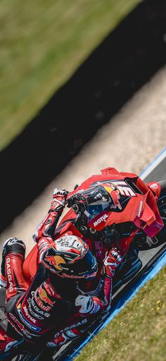 a person riding a motorcycle on a race track