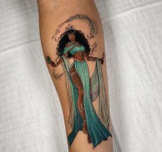 a woman's leg with a tattoo on it and an image of a woman