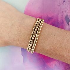 Trinity Bracelet Stack One of each size- how can you go wrong!? This is the ultimate starter pack for bracelet stacking. Every single one is made from 14kt gold-filled beads- safe for swim, showering, and sweating (but we'd recommend taking them off if you remember to keep them looking shiny and bright for as long as possible!) Our bracelets fit wrists comfortably up to 6.5" and are made with stretchy string so that they are easy and convenient to roll on and off! For custom size bracelets, plea Stackable Rose Gold Beaded Bracelets, Stackable Round Beads Bracelets In Rose Gold, Rose Gold Stackable Beaded Bracelets, Minimalist Stackable Rose Gold Bracelets, Minimalist Rose Gold Stackable Bracelets, Stackable Rose Gold Bracelets In 14k Gold Filled, Adjustable Stackable Rose Gold Bracelet, Dainty Rose Gold Stackable Beaded Bracelets, Dainty Rose Gold Stackable Bracelets