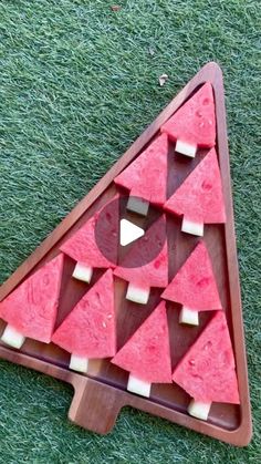 a piece of art made out of slices of watermelon