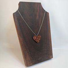 "This heart necklace is carved out of solid wood. Lightweight and ideal for daily wearing. 18\" stainless steel chain included. Wood measures approximately 1.4\" tall x 1.5\" wide. Available in a similar style in earrings: https://www.etsy.com/listing/703026553/wood-earrings-wooden-jewelry-lightweight The item ordered comes in a cute gift bag. Free shipping for US customers! Made and shipped from the United States. Interested in wholesale? No problem! Send me a message and I will be happy to wor Carved Heart Jewelry Gift, Carved Heart-shaped Jewelry For Gift, Heart Shaped Carved Jewelry Gift, Heart-shaped Carved Jewelry Gift, Carved Heart Shaped Jewelry Gift, Etched Heart Pendant Necklace For Valentine's Day, Personalized Brown Necklace For Gift, Etched Heart Pendant Necklace For Gift, Engraved Brown Necklace For Gift