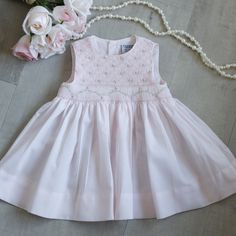 This Adorable Baby Girl's Dress In Size 6 Months Is Precious! Perfect For Spring! The Entire Front Bodice Is Done In A Lattice Smocking With Adorable Little Floral Bullion Rosebuds Evenly Spaced Throughout The Lattice Design. Just Above The Waist Has An Accordion Row Of Smocking With A Pink And White Embroidered Border. A Pink, White And Green Floral Vine Is Embroidered Across The Accordion Smocking. Gorgeous Details! This Dress Was Bought New And Never Worn. Perfect Condition! Nwot Friedknit Cr Fitted Sleeveless Pink Baptism Dress, Spring Sleeveless Baptism Dress, Pink Fitted Smocked Dress For Baptism, Pink Smock Dress For Baptism, Fitted Sleeveless Cotton Baptism Dress, Sleeveless Smocked Dress For Playtime, Sleeveless Smocked Dress With Smocked Back For Playtime, Sleeveless Cotton Baptism Dress With Ruffles, Sleeveless Cotton Baptism Dress