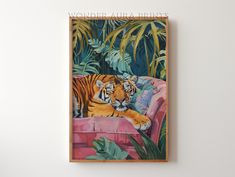 a tiger laying on top of a pink couch in front of some green plants and palm trees