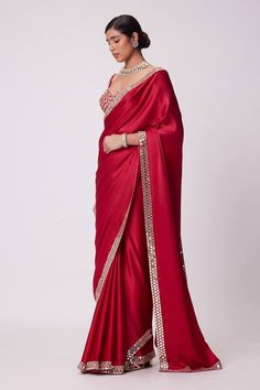 Crimson red saree crafted in satin with prism sheesha embroidery on the border. Paired with a half sleeves sweetheart neck blouse with mirror-vine embroidery. - Aza Fashions Festive Satin Pre-draped Saree, Red Pre-draped Saree For Eid Wedding, Red Katan Silk Pre-draped Saree For Designer Wear, Satin Pre-draped Saree With Pallu For Wedding, Wedding Satin Pre-draped Saree With Pallu, Semi-stitched Satin Saree With Cutdana, Elegant Satin Saree With Resham Embroidery, Bollywood Style Festive Satin Pre-draped Saree, Party Katan Silk Pre-draped Saree