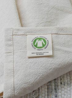 there is a white towel with a green label on it