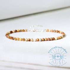 AAA+ Picture Jasper Gemstone Minimalist Bracelet 3MM Skinny Bead Delicate Bracelet Adjustable Tiny Stone Bead Bracelet Dainty Yoga Bracelet Gift️🌟❤️🌈🌿 🌟Material : Picture Jasper, Natural Stones, Natural Crystal, Raw Stone 🌟Quality: AAA+ 🌟Length: fit for 6.3 ~ 7.3 inches wrists 🌟Size: Adjustable 🌟Beads size: 3mm 🌟+ Free gift pouch From the choice of materials to the precision in assembly, it exudes a sense of durability and reliability, It's not merely an item; it's an experience. Bravo! Minimalist Crystal Bracelet With Natural Stones, Minimalist Beaded Bracelets For Healing, Minimalist Round Beaded Bracelets For Healing, Adjustable Hand-strung Jasper Jewelry, Adjustable Jasper Beaded Bracelets With 8mm Beads, Minimalist Gemstone Beaded Bracelets, Adjustable Beaded Jasper Bracelets, Beaded Jasper Jewelry Bracelet, Jasper Beaded Bracelet Jewelry