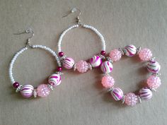 Earring and bracelet set that I made using white pearl beads, pink pearls, pink and white swirl bead mix, and metal spacers. Adjustable Pink Earrings With Large Beads, Adjustable White Hoop Earrings With Colorful Beads, White Hoop Earrings With Colorful Beads, Pink Pearl Beaded Earrings, Pink Jewelry With Spacer Beads For Jewelry Making, Pink Pearl Beaded Bracelets For Jewelry Making, Handmade Pink Pearl Beads, Pink Round Pearl Beads, White Beaded Bracelets With Dangling Beads