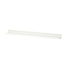 a white shelf that is on top of a wall and has a light in it