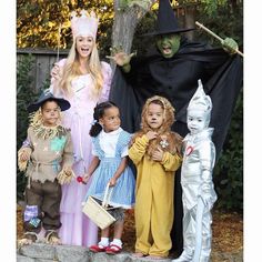 a group of children dressed up in costumes