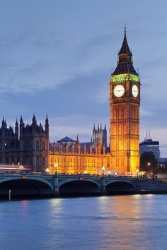 the big ben clock tower towering over the city of london, england at night time