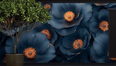 there is a blue flower wallpaper with orange flowers on it and a potted plant next to it