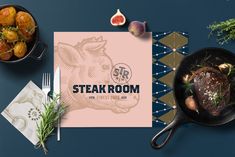 an overhead view of steak in a skillet next to other food items and utensils