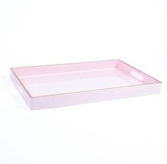 a pink rectangular tray with handles on a white background, it looks like something out of an ordinary box