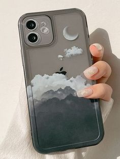 a woman's hand holding an iphone case with clouds and moon in the sky