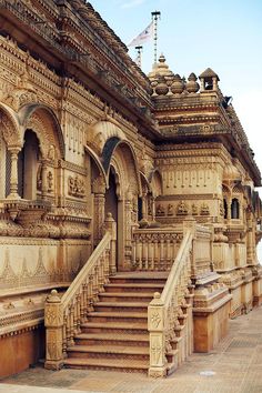 an elaborately carved building with steps leading up to it