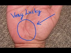 a hand with the words very lucky written on it and an arrow pointing to the left