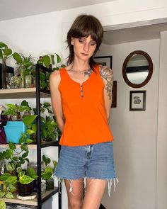 1980's/90's bright orange tank top in great used shape No rips or tears, faint mark on the back, pictured at end Tag say size small, please check against measurements for an accurate fit  Measurements  Shoulders seam to seam - 10" Armpits seam to seam -16.5 " Total length - 21.5" Please see all photos as they are part of the description Prices reflect age, condition, weight & novelty ~ ☆ All my vintage items have been curated for their quality and carefully cleaned before photographing. Because Summer Y2k Orange Top, Retro Orange Sleeveless Top, Orange Vintage Relaxed Fit Tops, Orange Sleeveless Cotton Tank Top, Orange Cotton Sleeveless Tank Top, Orange Summer Tops With Built-in Bra, Spring Orange V-neck Tank Top, Orange Tank Top, Not Perfect