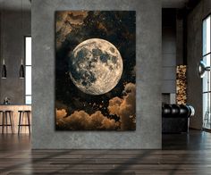 a full moon in the night sky with clouds and stars above it, framed on a wall