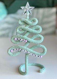 a small christmas tree made out of rope