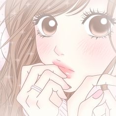 a girl with long hair and big eyes is looking at the camera while holding her hand to her face