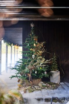 a small christmas tree sitting on top of a wooden table