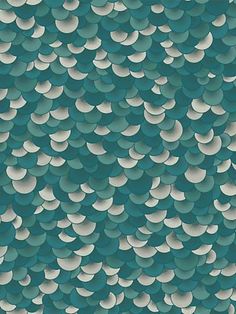 a blue and white wallpaper with lots of small circles on the top of it