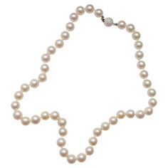 This is a stunning vintage pearl necklace measuring 18 inches in length and composed of 55 9mm-9.4mm round cultured Akoya pearls and finished with an 18K white gold beaded ball clasp which glitters with a multitude of small full-cut diamonds that total approximately .50 carats. The necklace was purchased in the United Kingdom but bears no hallmarks. It's very well-made and remains on its original silk, which still appears sturdy. I believe the necklace dates to the 1980s. Cultured Akoya pearls over 8mm in diameter are the most coveted of all Akoya pearls because fine ones are difficult to achieve. The longer a pearl remains inside the oyster the thicker the nacre and larger it grows but the greater the opportunity for any number of variables to come along and spoil the pearl. These large 9 Luxury Beaded Akoya Pearl Necklace, Luxury White Gold Necklace With Round Beads, Luxury Vintage Akoya Pearl Jewelry, Vintage Pearl Necklace, Akoya Pearl Necklace, Pearl Necklace Vintage, Pearl And Diamond Necklace, Small Necklace, Necklace Diamond