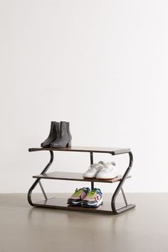 a pair of shoes sitting on top of a shelf