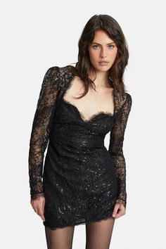 The Aurora Sequin Lace Mini Dress is a little black dress with attitude. Raw lace edging and the black colorway are balanced with sequins along the flower motifs and elegant long sleeves. A party favorite. Runs true to size Model is 5'8" and wears a size SMALL Bust cups fit a B-C cup Lace design Sequin embellishments Raw edging Long sleeves Mini hemline Fabrication: Main Sequin: 100% Polyethylene terephthalate. Main Base: 100% Nylon. Lining: 72% Nylon, 28% Elastane. Lace: 100% Nylon Designed in Fitted Lace Trim Dress For Party, Evening Lace Dress For Party Season, Fitted Party Dress With Lace Sleeves, Fitted Lace Party Dress, Elegant Lace Sequin Party Dress, Elegant Party Sequin Lace Dress, Fitted Long Sleeve Lace Dress For Evening, Fitted Long Sleeve Lace Evening Dress, Lace Dress With Sheer Sleeves For Party