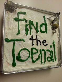 a cake with green frosting that says find the topial on it's side